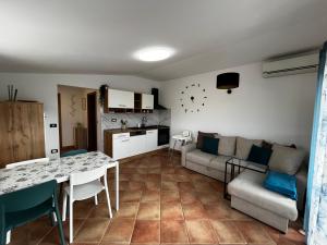 a living room with a couch and a table at Apartment Storia Romantica in Koper +13 photos