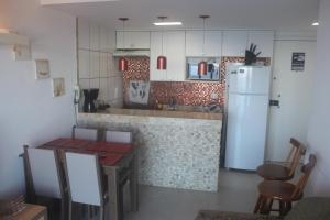 Η κουζίνα ή μικρή κουζίνα στο Apartamento Praia Porto Real