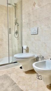 a bathroom with a tub and a toilet and a sink at Casa Sessera in Coggiola +27 photos