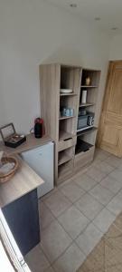 a kitchen with wooden cabinets and a counter top at villa Lucciana in Lucciana