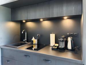 a kitchen with a sink and a counter top at High Moor Glamping in Jalhay