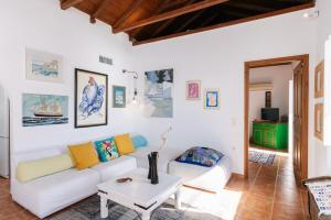 a living room with a couch and a table at Marcela's house in Hydra