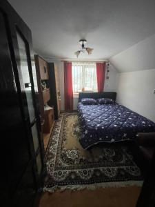 En eller flere senge i et værelse på Casa Larisa