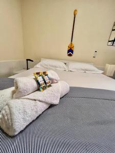 En eller flere senge i et værelse på Casa a 150m da Praia Barra da Tijuca