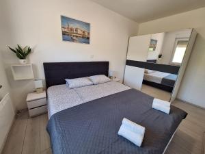 Postel nebo postele na pokoji v ubytování Holiday home Laura