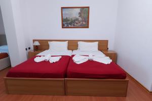 Postel nebo postele na pokoji v ubytování Vila Viktoria Golem