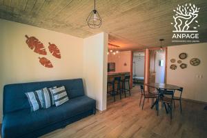 a living room with a couch and a table at Cabin-style apartment - Anpage in Puente de las Cuevas