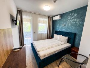 Postel nebo postele na pokoji v ubytování Hotel Dalia
