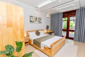 Кровать или кровати в номере Trung tâm Ninh Bình- Hearth Light Home - Nguyên căn 3 tầng 200m2 3PN