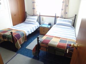 En eller flere senger på et rom på Jomarnic B&B