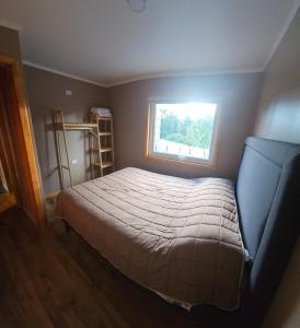 Ένα ή περισσότερα κρεβάτια σε δωμάτιο στο Casa Parcela, Bosques de Frutillar +4 φωτογραφίες