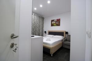 Postel nebo postele na pokoji v ubytování Hotel Keli
