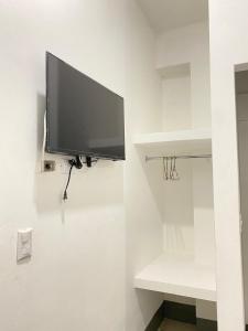 TV a/nebo společenská místnost v ubytování Hostal Crisangel + 7 fotografií