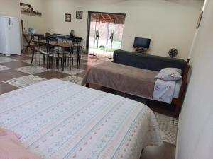 Postel nebo postele na pokoji v ubytování Loft Mundo Novo - A paz no coração da Mantiqueira