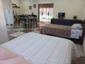 Postel nebo postele na pokoji v ubytování Loft Mundo Novo - A paz no coração da Mantiqueira