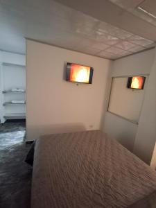 Giường trong phòng chung tại ZIG ZAG Hospedaje