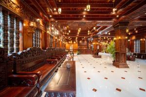 a large room with rows of benches in a building at Puok Resort in Phumĭ Puŏk Chăs +150 photos