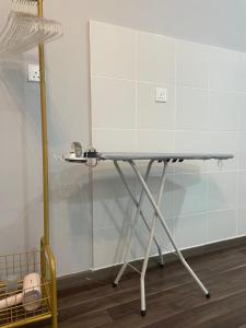 a table in the corner of a room at Amyra Suite Kuantan in Kuantan