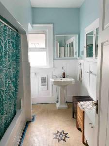 a bathroom with a sink and a white sink at Craftsman Home in popular East Village in Vancouver +53 photos