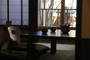 a table with cups on it in front of a window at 龍助25ANNEX Ryusuke25ANNEX in Komatsu
