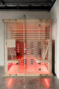 a glass case with two beds in a room at Zoarii Luxury Beach Front Wellness Stay in Ventnor