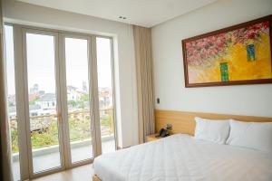 Postel nebo postele na pokoji v ubytování Min Min Hotel