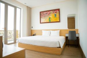 Postel nebo postele na pokoji v ubytování Min Min Hotel