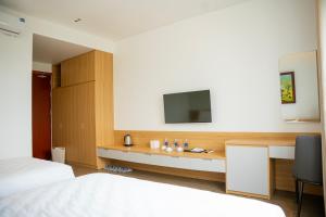Postel nebo postele na pokoji v ubytování Min Min Hotel