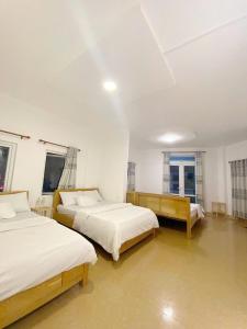 Katil atau katil-katil dalam bilik di 05 Đoàn Thị Điểm Hotel