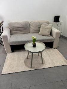 a living room with a couch and a table at Cozy Place in Alfortville