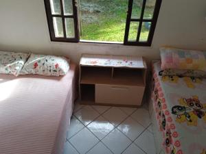 Postel nebo postele na pokoji v ubytování 1 Quarto em Local Acolhedor e Familiar