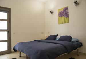 Postel nebo postele na pokoji v ubytování Olivier Residence