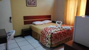 Postel nebo postele na pokoji v ubytování Hostal Saloah