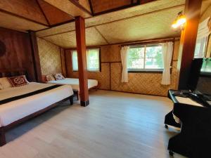 Postel nebo postele na pokoji v ubytování Baantawan Guesthouse Pai