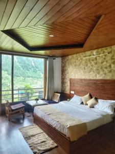 Ένα ή περισσότερα κρεβάτια σε δωμάτιο στο Aanagha Stay & cafe