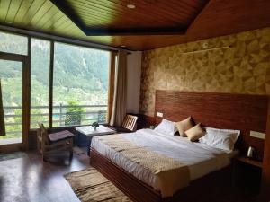 Ένα ή περισσότερα κρεβάτια σε δωμάτιο στο Aanagha Stay & cafe +46 φωτογραφίες