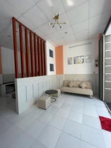 Posezení v ubytování HIDU House Cần Thơ + 5 fotografií