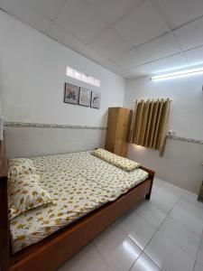 Postel nebo postele na pokoji v ubytování HIDU House Cần Thơ