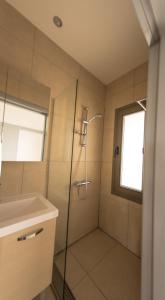 a bathroom with a shower and a sink at Olivier Residence in Nicosia