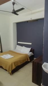 Postel nebo postele na pokoji v ubytování Hotel Orginal Residency