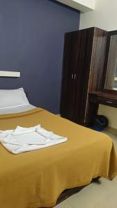 Postel nebo postele na pokoji v ubytování Hotel Orginal Residency