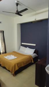 Postel nebo postele na pokoji v ubytování Hotel Orginal Residency