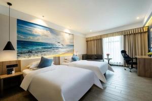 Un pat sau paturi într-o cameră la hailihotel