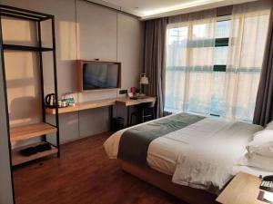 Μια τηλεόραση ή/και κέντρο ψυχαγωγίας στο GreenTree Inn Wuxi Quanshan Center