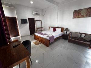 Letto o letti in una camera di Ciel Star Anuradhapura