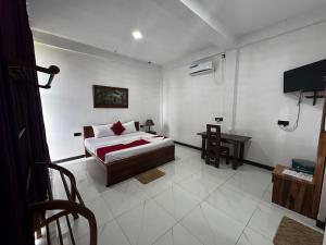 Letto o letti in una camera di Ciel Star Anuradhapura