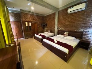 Letto o letti in una camera di Ciel Star Anuradhapura