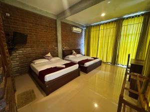 Letto o letti in una camera di Ciel Star Anuradhapura