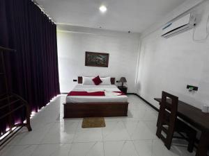 Letto o letti in una camera di Ciel Star Anuradhapura