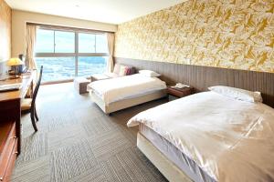 Postel nebo postele na pokoji v ubytování Shiosai Resort Kamogawa